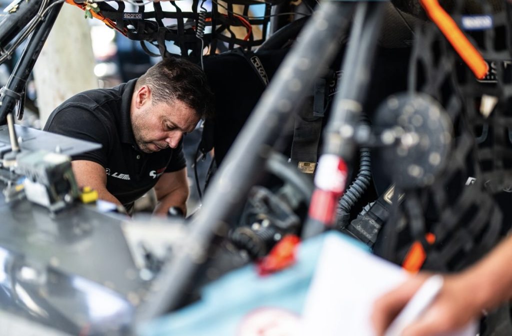 person working in a race car